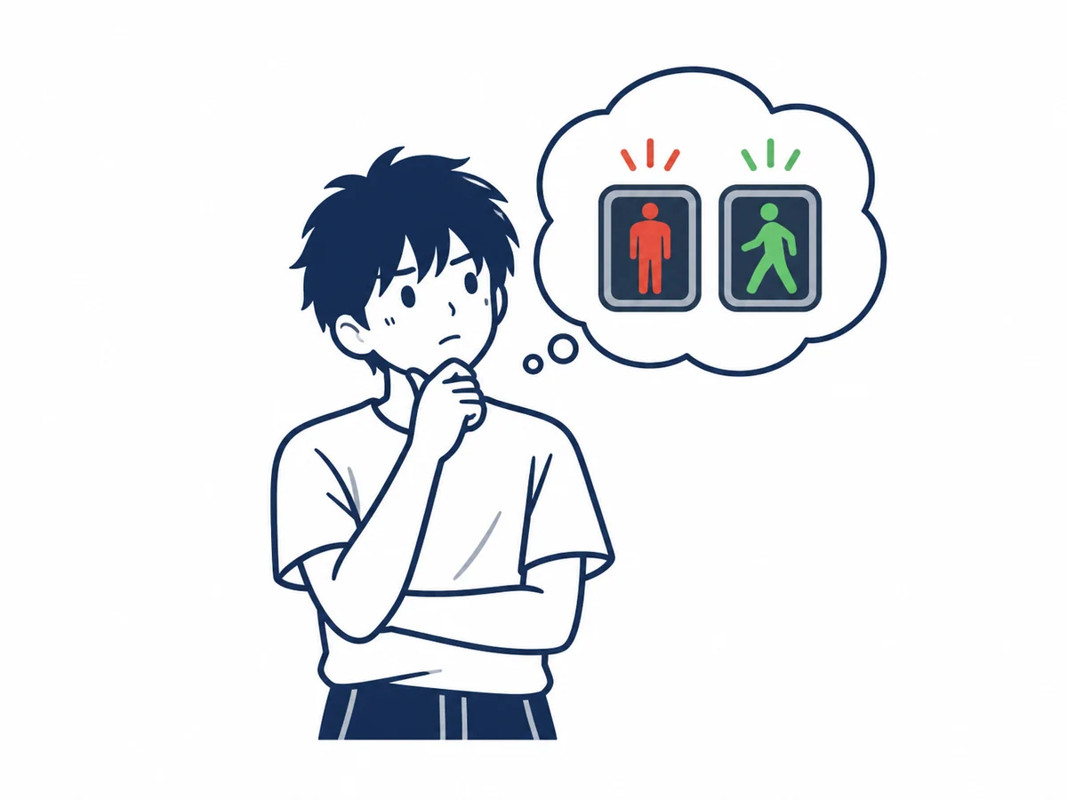 赤は止まれ、青は進んでいいというルールを思い出す少年